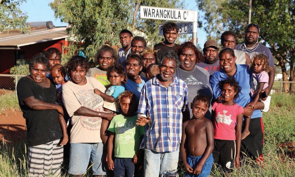 Warangkula family portrait alongside Warangkula Court street sign - Photo Helen Puckey