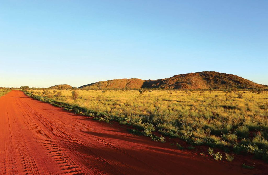 Papunya’s famous Honey Ant hills, also known as Warumpi and Tjupi, as seen from the road to Three Mile outstation. Photo- Helen Puckey