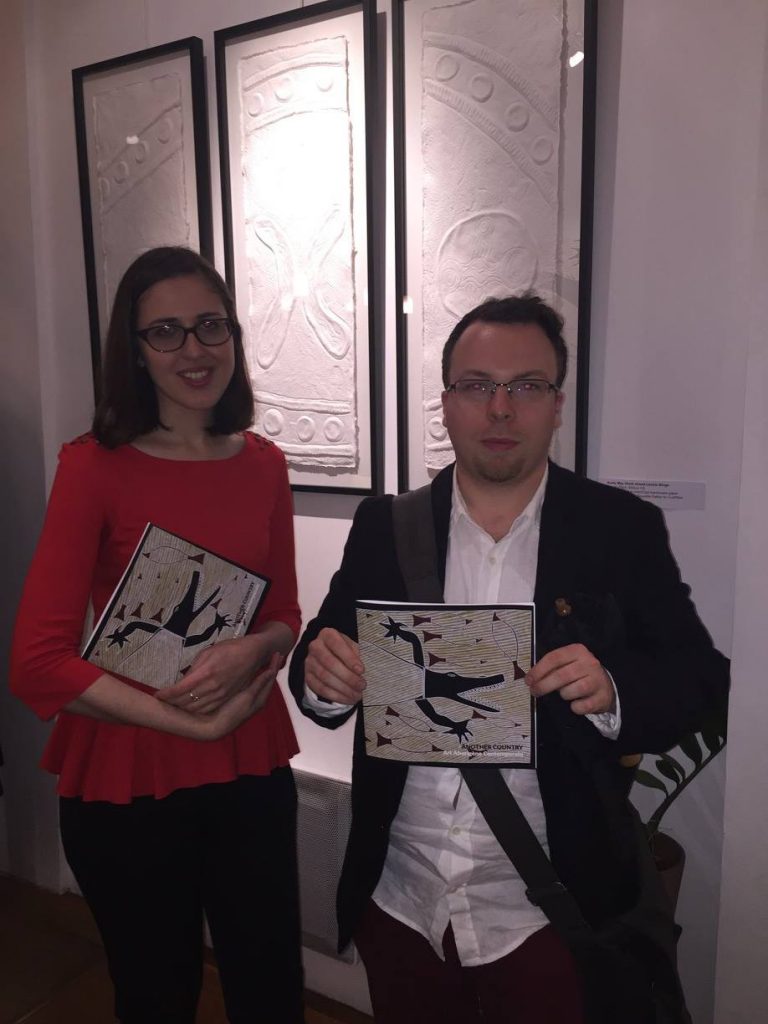 Julien Jourand proudly showing the catalogue for exhibition "Another Country" in Paris, with Diane Scurtu, at the opening on 31 May 2016 - Photo IDAIA