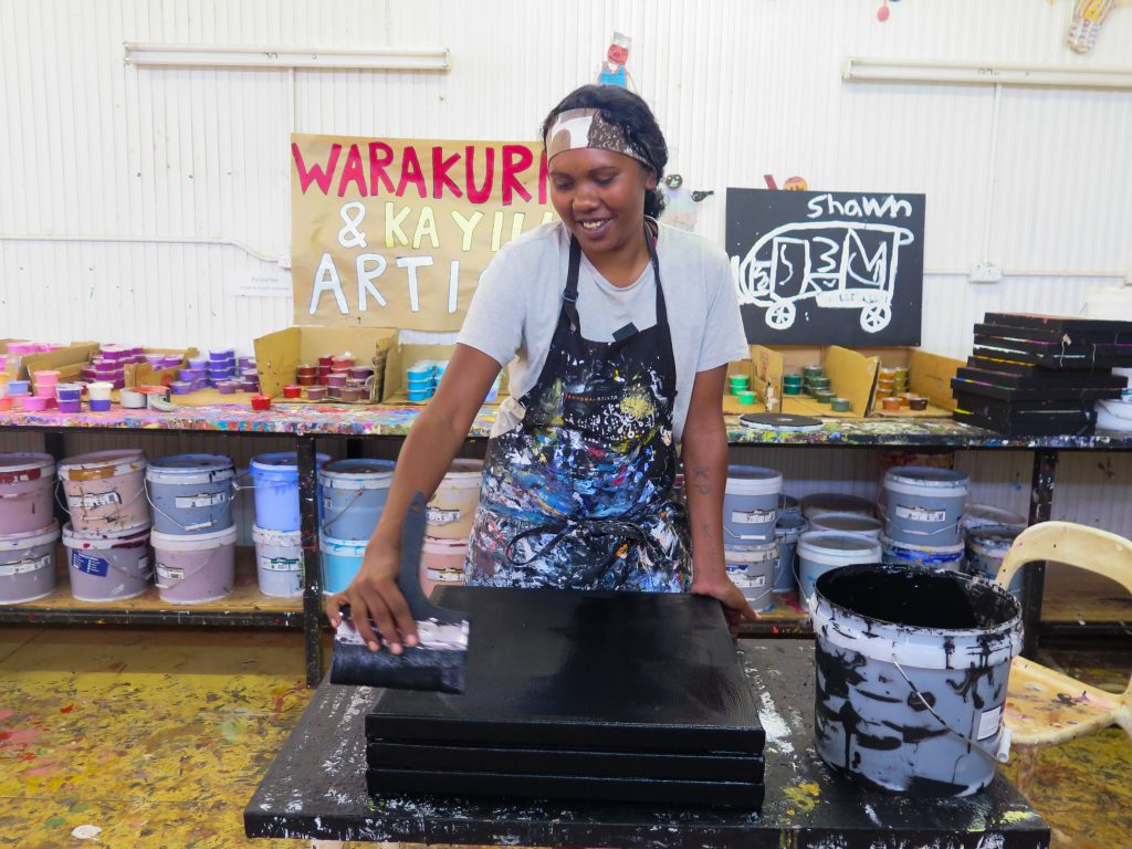 Kristabell Porter at work - Photo courtesy of Warakurna Artists