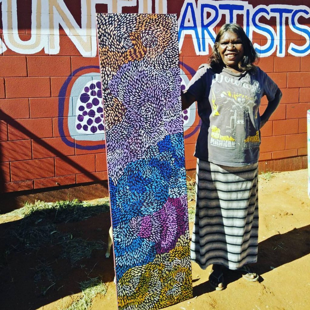 Artist Daphne Marks with her 'Yalka Tjukurrpa' painting in Haasts Bluff, NT © Chrischona Schmidt and Ikuntji Artists