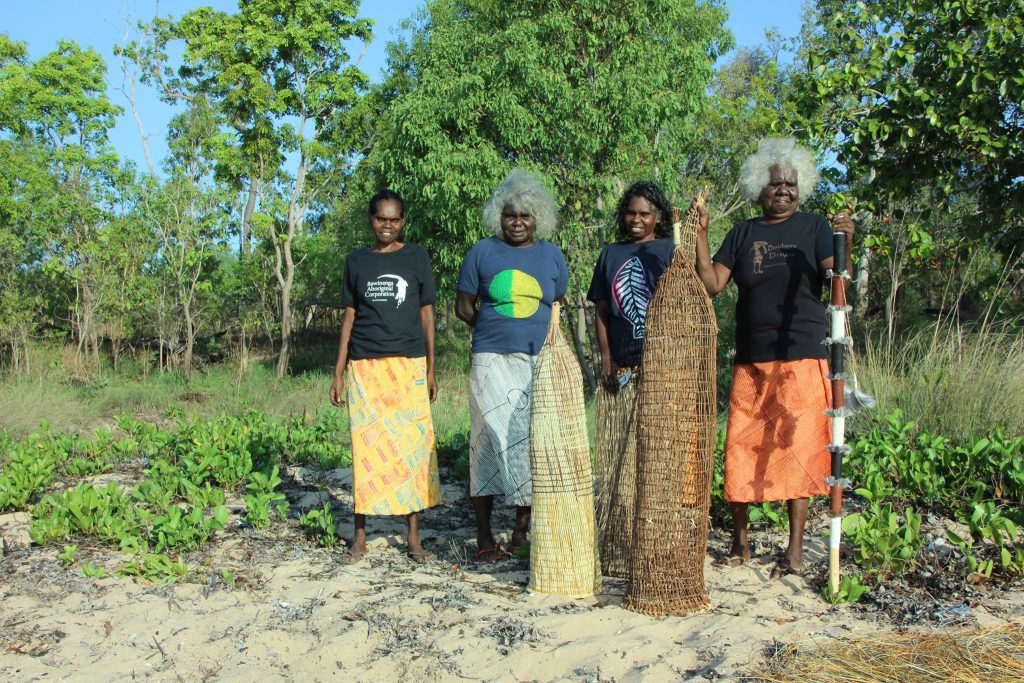 Babbarra women Jennifer, Phyllis, Deborah and Lennie on the Maningrida beach - Photo Babbarra Women's Centre