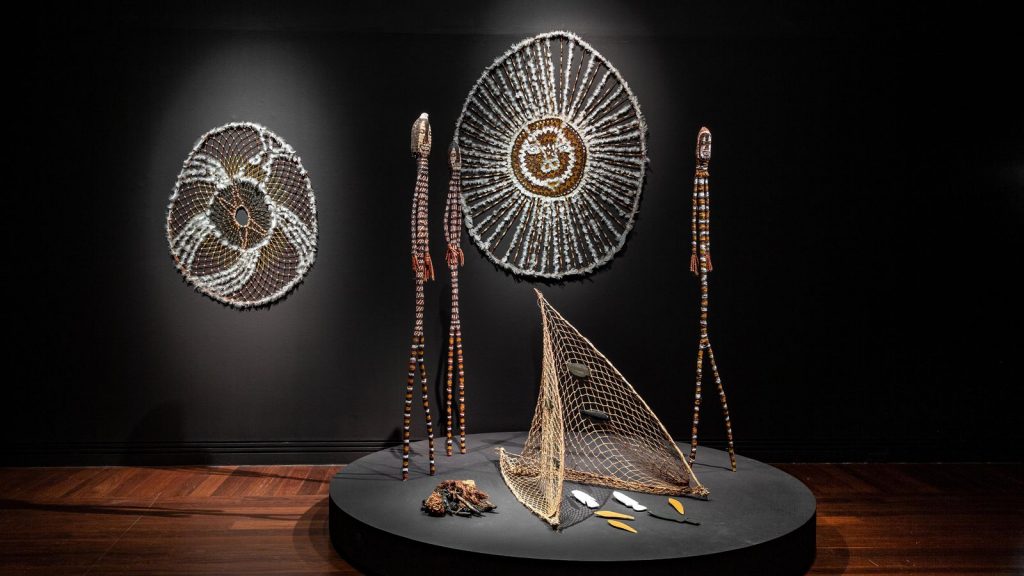 Installation view - Tarnanthi 2020 Open Hands featuring Karrh (Spider) and Ngalbenbe (sun story) by Lena Yarinkura, Art Gallery of South Australia, Adelaide, © Lena Yarinkura, Maningrida Arts and Culture, Copyright Agency; photo Saul Steed